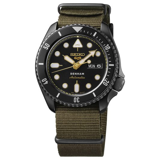 SEIKO 5 Sports SBSA283 DENHAM Limited Edition – black sunray dial with gold accents, stitching-inspired motif, black/gray rotating bezel, green nylon strap, automatic movement, and 100m water resistance.