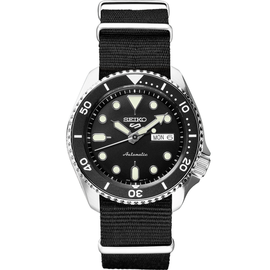 Seiko 5 Sports SRPD89 – rugged black dial automatic watch with rotating bezel, LumiBrite hands, screwdown see-through caseback, and black nylon strap; built for everyday durability and style.