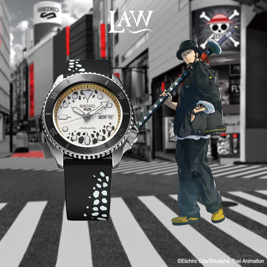 SEIKO 5 Sports One Piece Trafalgar D. Water Law Limited Edition – white and black patterned dial with beige accents, logo caseback, black rotating bezel, automatic movement, and 100m water resistance