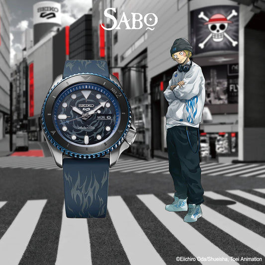 SEIKO 5 Sports One Piece Sabo Limited Edition – black and gray patterned dial with blue accents, blue caseback with Sabo’s logo, black and blue bezel, automatic movement, and 100m water resistance