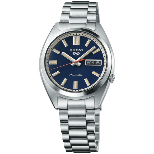 SEIKO SRPK87 from the Seiko 5 Sports collection – compact stainless steel case, deep blue dial with metallic accents, day/date display, automatic movement, and 100m water resistance.