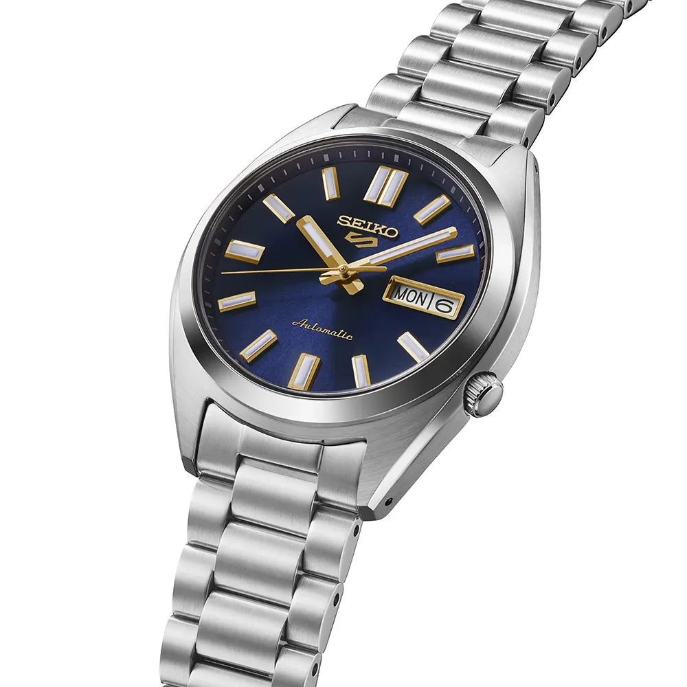 Seiko watch with silver metal bracelet and blue dial on a white background