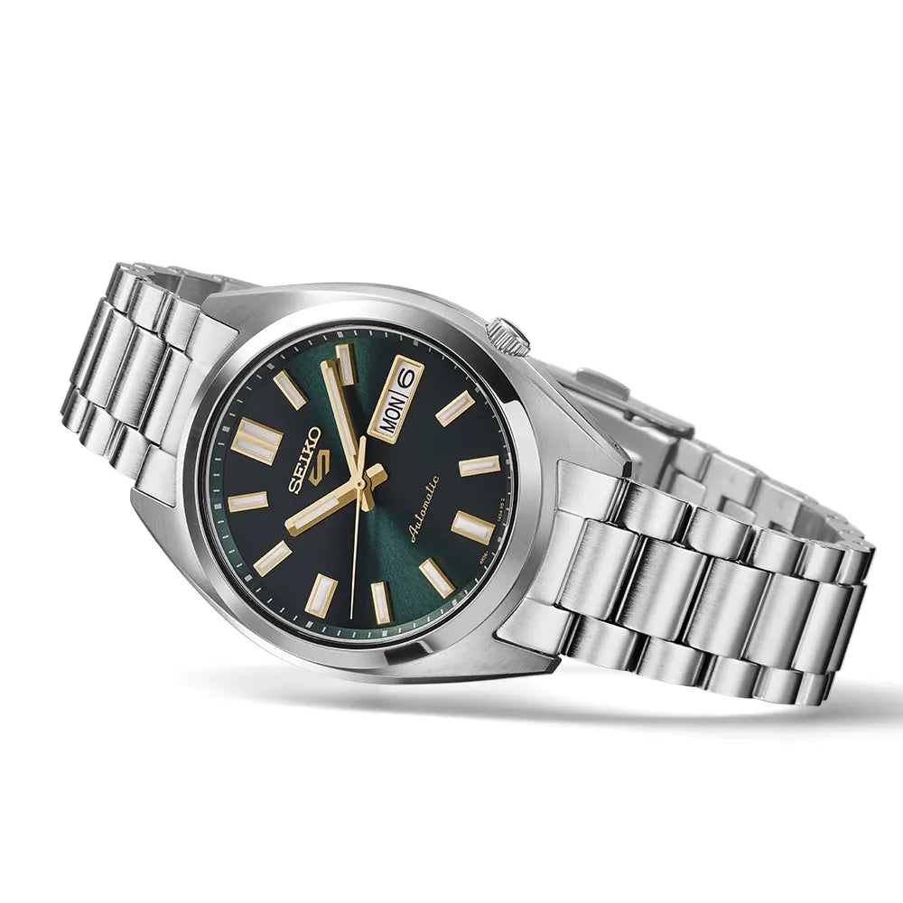 Silver Seiko watch with a green dial on a white background