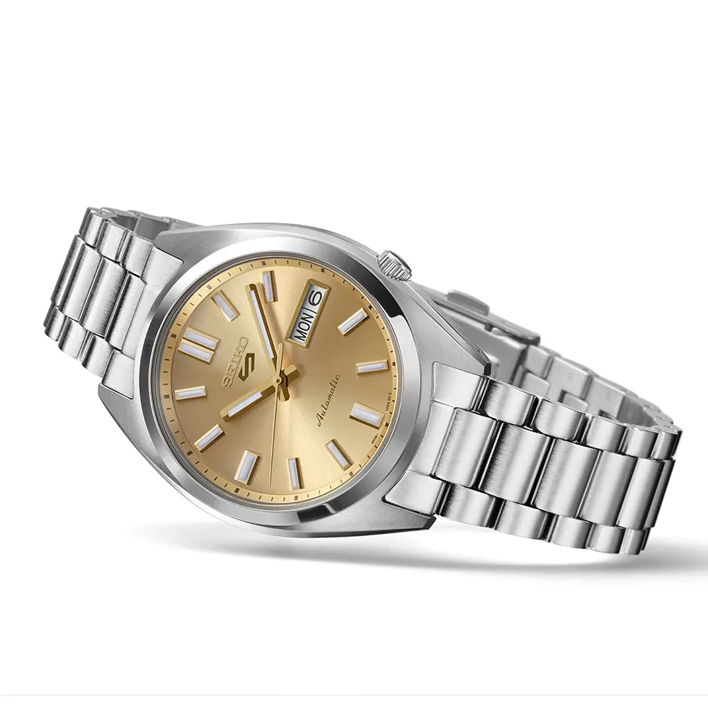 Silver watch with gold face on a white background