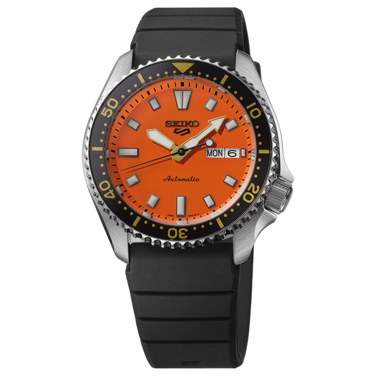 SEIKO 5 Sports SRPL89 SKX Sports Style – vivid orange dial, black rotating bezel with gold accents, black silicone strap, automatic movement, and 100m water resistance.