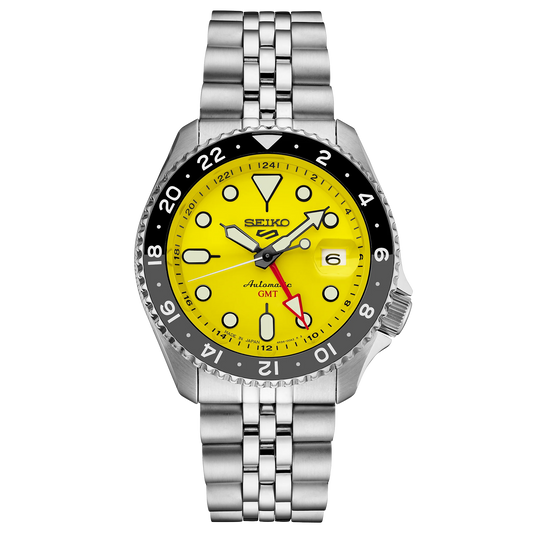 Seiko watch with yellow dial and silver metal bracelet on a white background