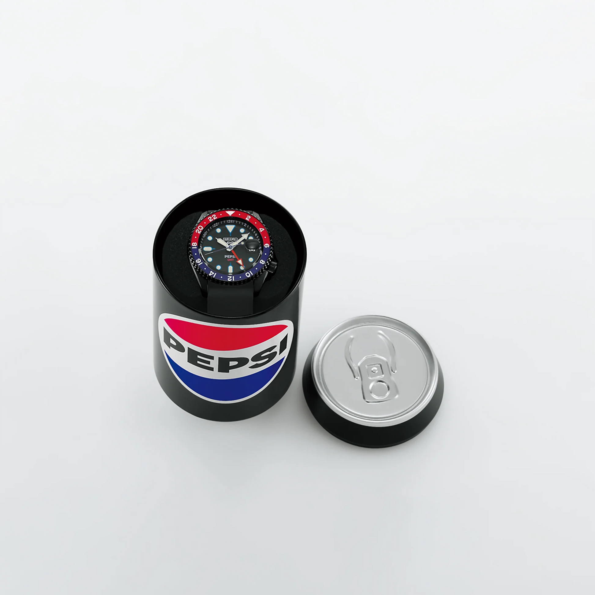 Pepsi branded watch in a cylindrical box on a white background