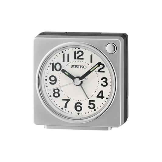 SEIKO QHE196SLH compact bedside alarm clock with silver square case, white analog dial, bold black numbers, LumiBrite-tipped hands, and quiet sweep second hand.