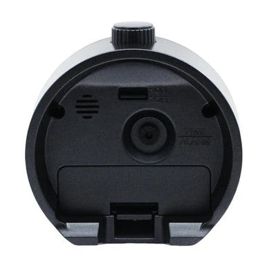 Back view of SEIKO QHE207KLH alarm clock showing black rear case, time and alarm controls, speaker opening, and on/off switch.