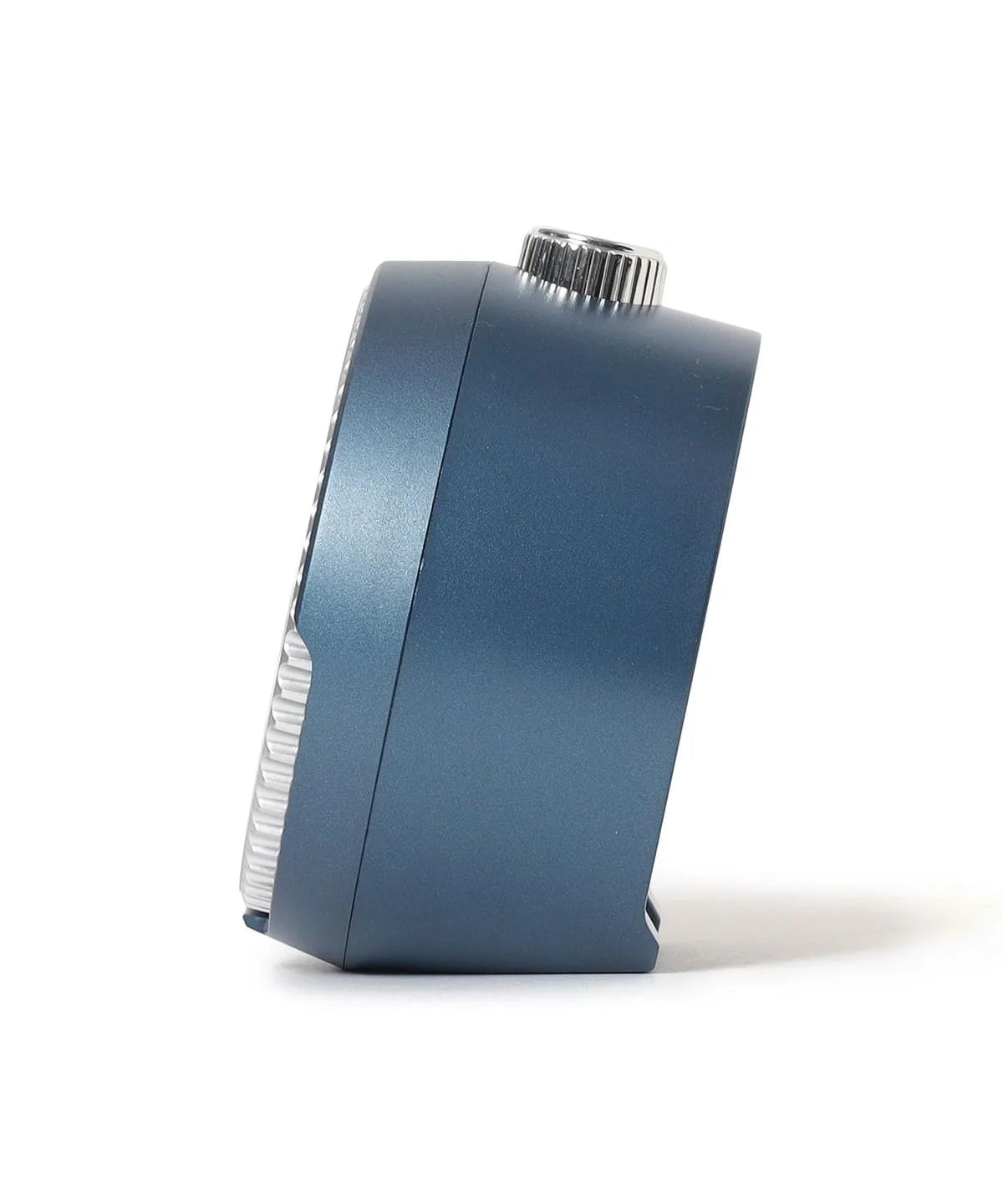 Side view of SEIKO QHE207LLH rotating bezel alarm clock showing its compact blue metallic case and top crown-style button.