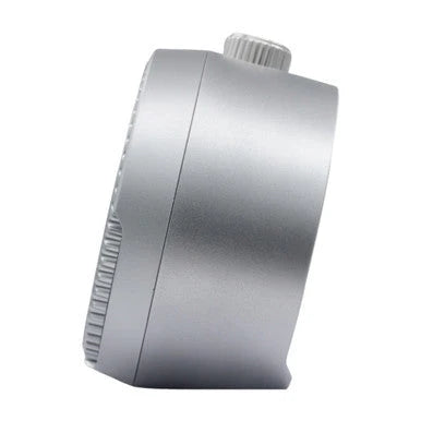 Side view of SEIKO QHE207SLH rotating bezel alarm clock showing its compact silver-gray case and top crown-style button.