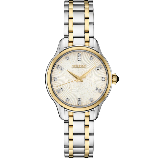 A two-tone stainless steel SEIKO DIAMONDS watch with a silver dial, gold accents, and a classic cabochon crown.