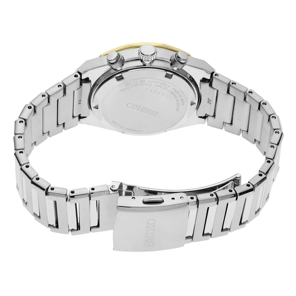 The back view of a Seiko stainless steel watch with a multi-link bracelet, showing the brushed metal case back and a small gold accent at the top crown.