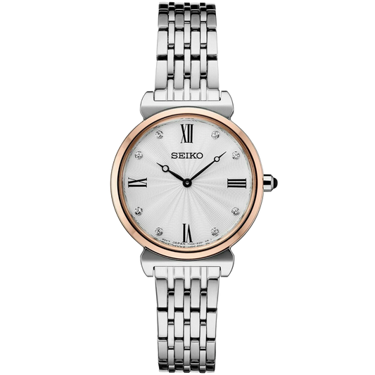 Seiko watch with silver and rose gold band on white background