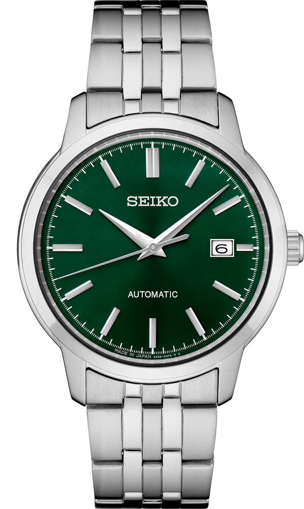 Seiko Essentials SRPH89 automatic watch with dark green sunray dial, stainless steel case and bracelet, date display, see-through caseback, and 100m water resistance.