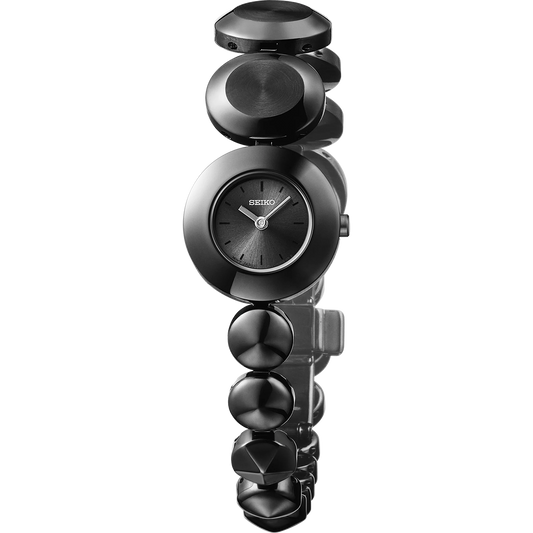 Seiko Essentials Power Design Project Limited Edition SSEH023 quartz watch with black monochromatic dial, black hard-coated stainless steel case, and asymmetric jewelry-inspired bracelet, limited to 500 pieces.