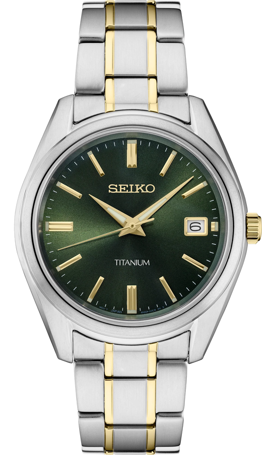 Seiko Essentials SUR377 quartz watch with green sunray dial, gold accents, two-tone titanium case and bracelet, sapphire crystal, and 100m water resistance.