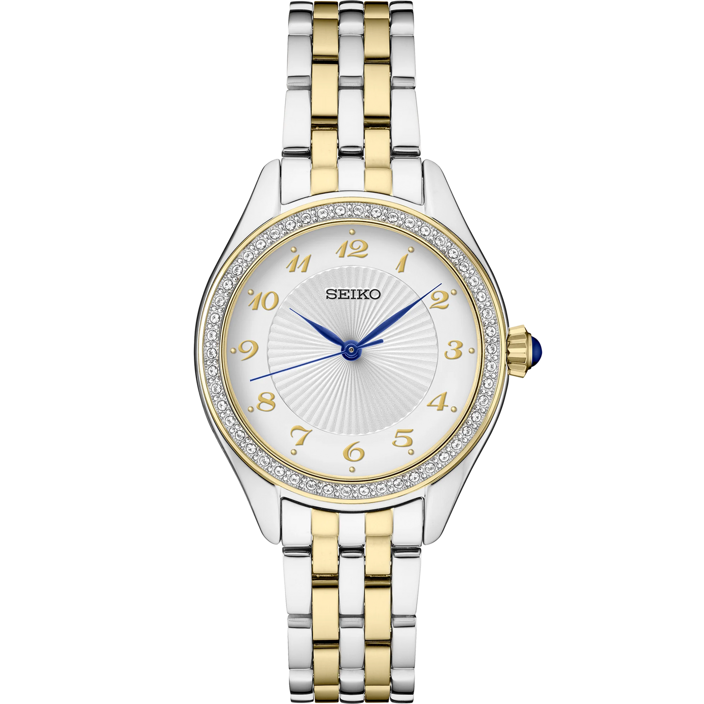 Seiko Essentials SUR392 quartz watch with patterned white dial, crystal accents, gold-tone Arabic numerals, blue hands, blue cabochon crown, two-tone stainless steel case and bracelet, and curved Hardlex crystal.