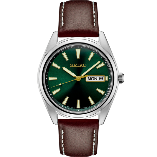 Seiko Essentials SUR449 quartz watch with green sunray dial, gold-tone accents, stainless steel case, brown leather strap, day-date display, sapphire crystal, LumiBrite hands and markers, and 100m water resistance.