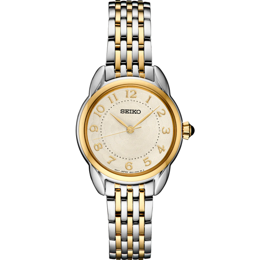Seiko SUR562 – elegant two-tone stainless steel watch with ivory patterned dial, gold hands, Arabic numerals, cabochon crown, and curved Hardlex crystal from the Essentials Collection.
