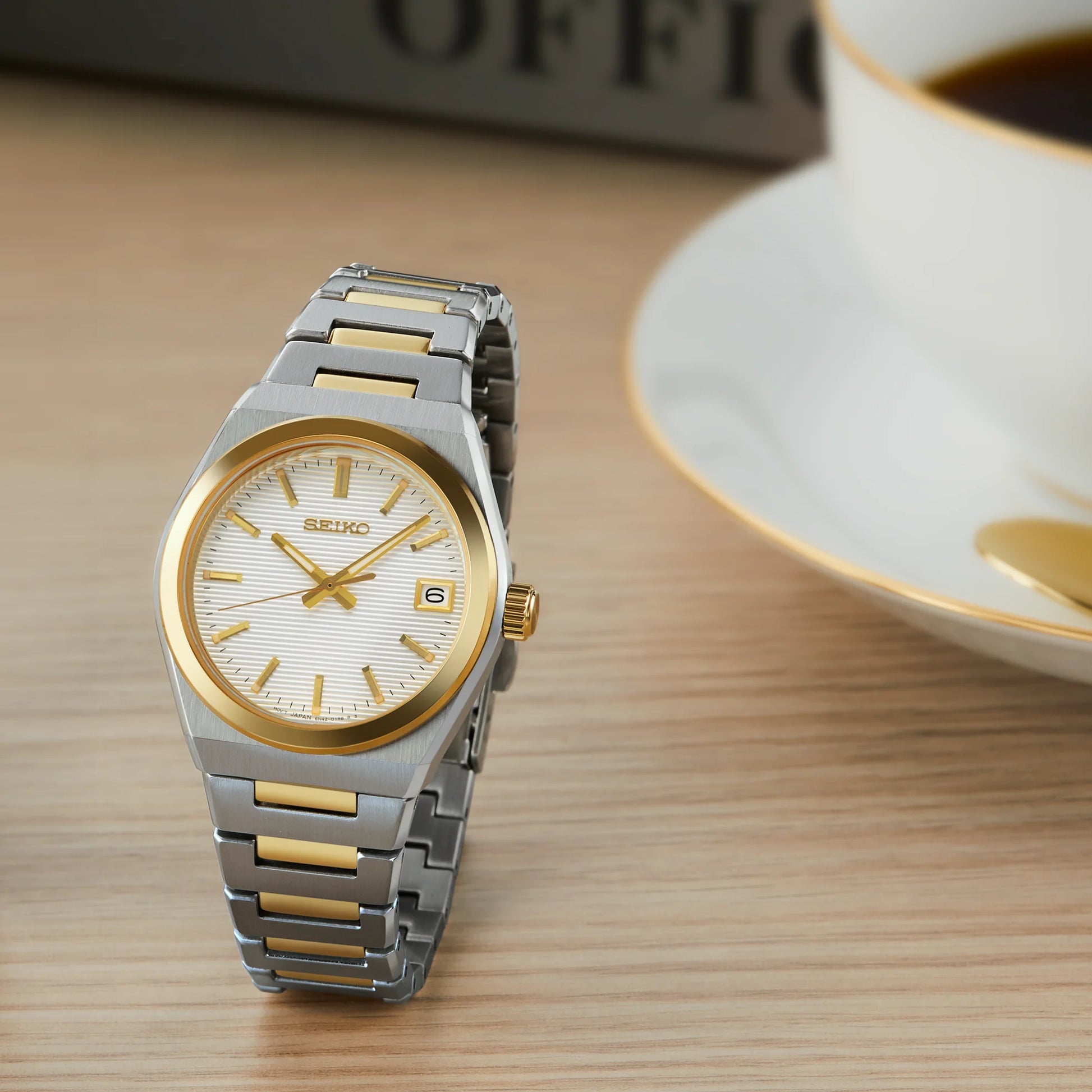 Seiko Essentials SUR578 - 34mm Two-Tone Stainless Steel Watch, White Dial with Gold-Tone Indices, Date Display, 100m Water Resistance, Quartz Movement