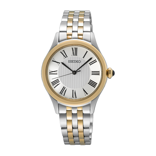 Seiko SUR612 Essentials – two-tone stainless steel quartz watch with white Roman numeral dial, gold-tone accents, sapphire crystal, and 50m water resistance.