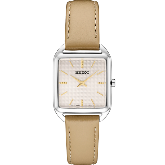 Seiko SWR089 – elegant square stainless steel watch with pale pink grid-pattern dial, gold hands and markers, beige leather strap, and slim profile from the Essentials Collection.