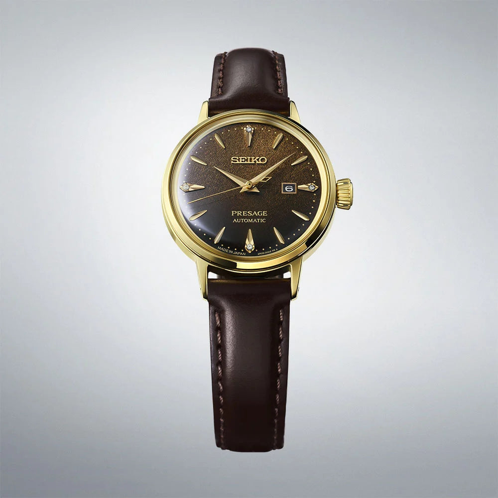 Seiko watch with brown leather strap on a gray background