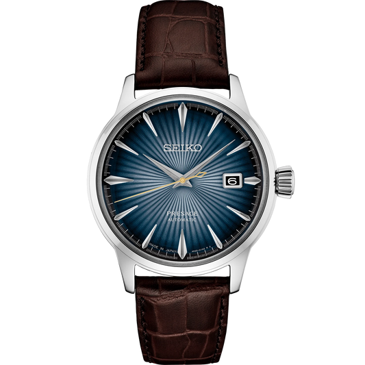 SEIKO Presage Cocktail Time – blue gradated dial inspired by the Blue Moon cocktail, stainless steel case, brown leather strap, automatic 23-jewel movement, and 50m water resistance.