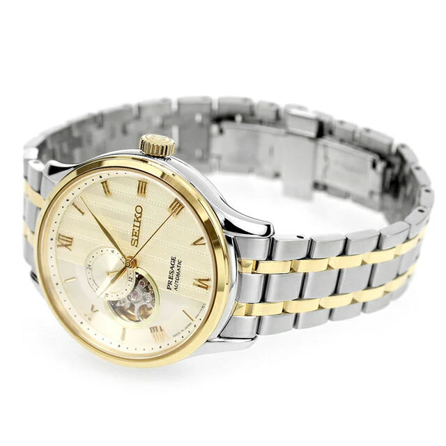 Seiko Presage SSA464 Japanese Garden – ivory-gold dial automatic watch with open-heart display, 24-hour sub-dial, dual-curved sapphire crystal, two-tone bracelet, and see-through caseback.