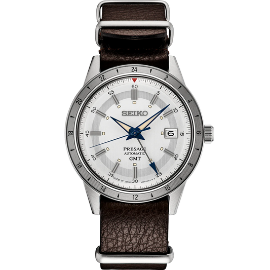 SEIKO Presage 110th Anniversary Limited Edition – white dial with silver GMT bezel, retro 1960s car-inspired design, automatic GMT movement, sustainable brown leather strap, and 100m water resistance.