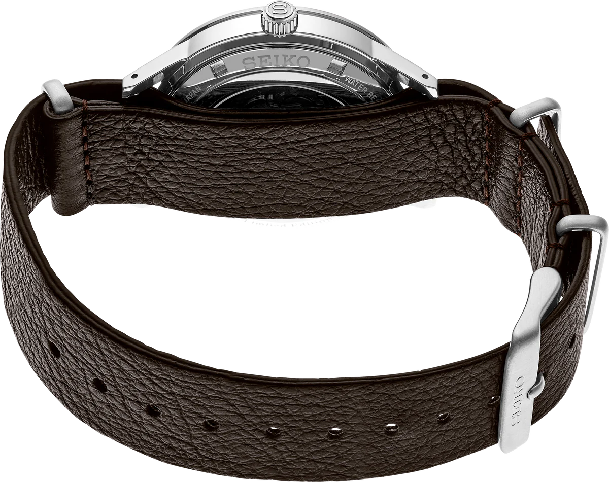 SEIKO Presage 110th Anniversary Limited Edition – white dial with silver GMT bezel, retro 1960s car-inspired design, automatic GMT movement, sustainable brown leather strap, and 100m water resistance.