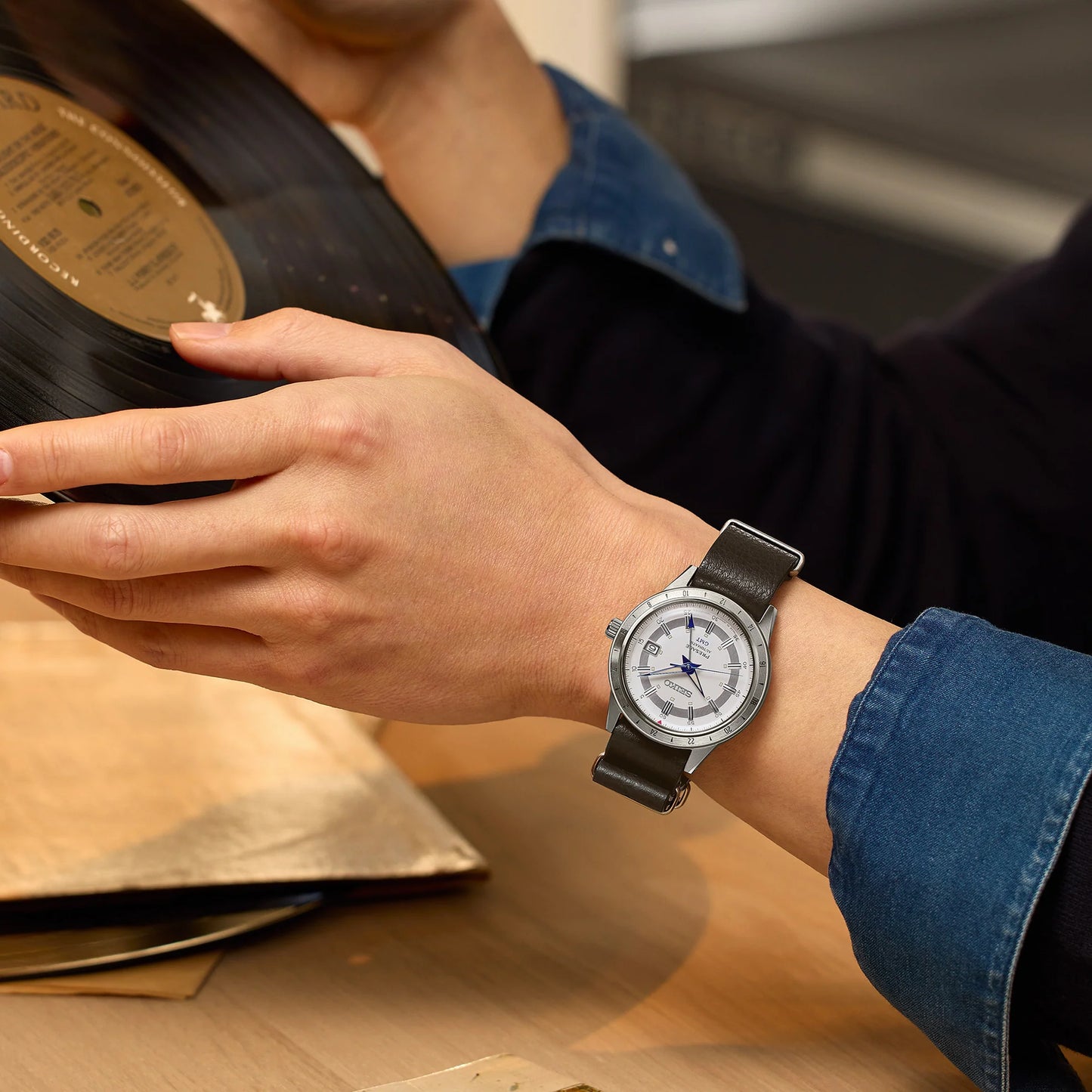 SEIKO Presage 110th Anniversary Limited Edition – white dial with silver GMT bezel, retro 1960s car-inspired design, automatic GMT movement, sustainable brown leather strap, and 100m water resistance.
