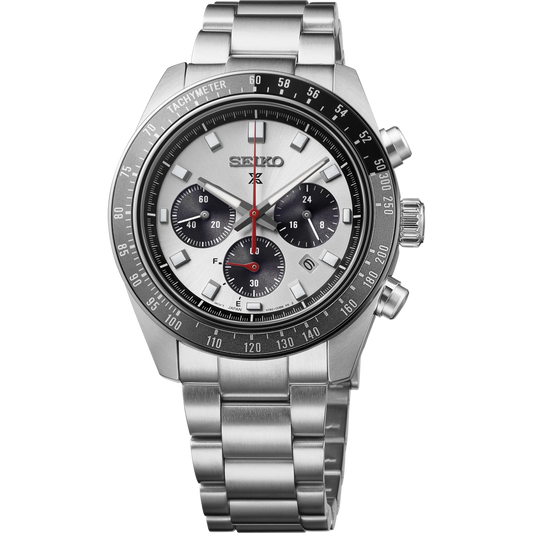 A Seiko stainless steel chronograph watch with a silver-tone metal bracelet, black tachymeter bezel, white dial, and black subdials with red accents.