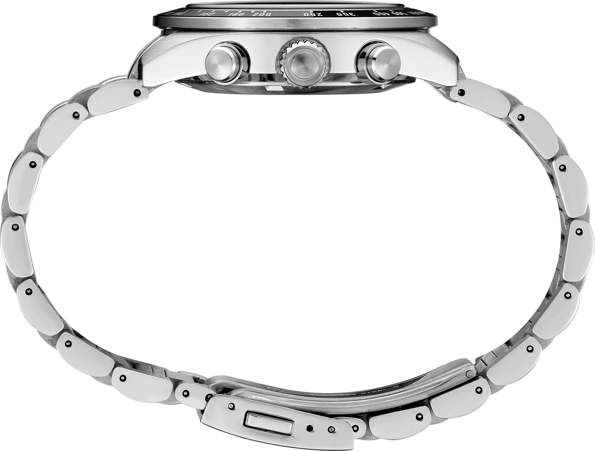 Close-up of a silver watch with detailed design on a white background