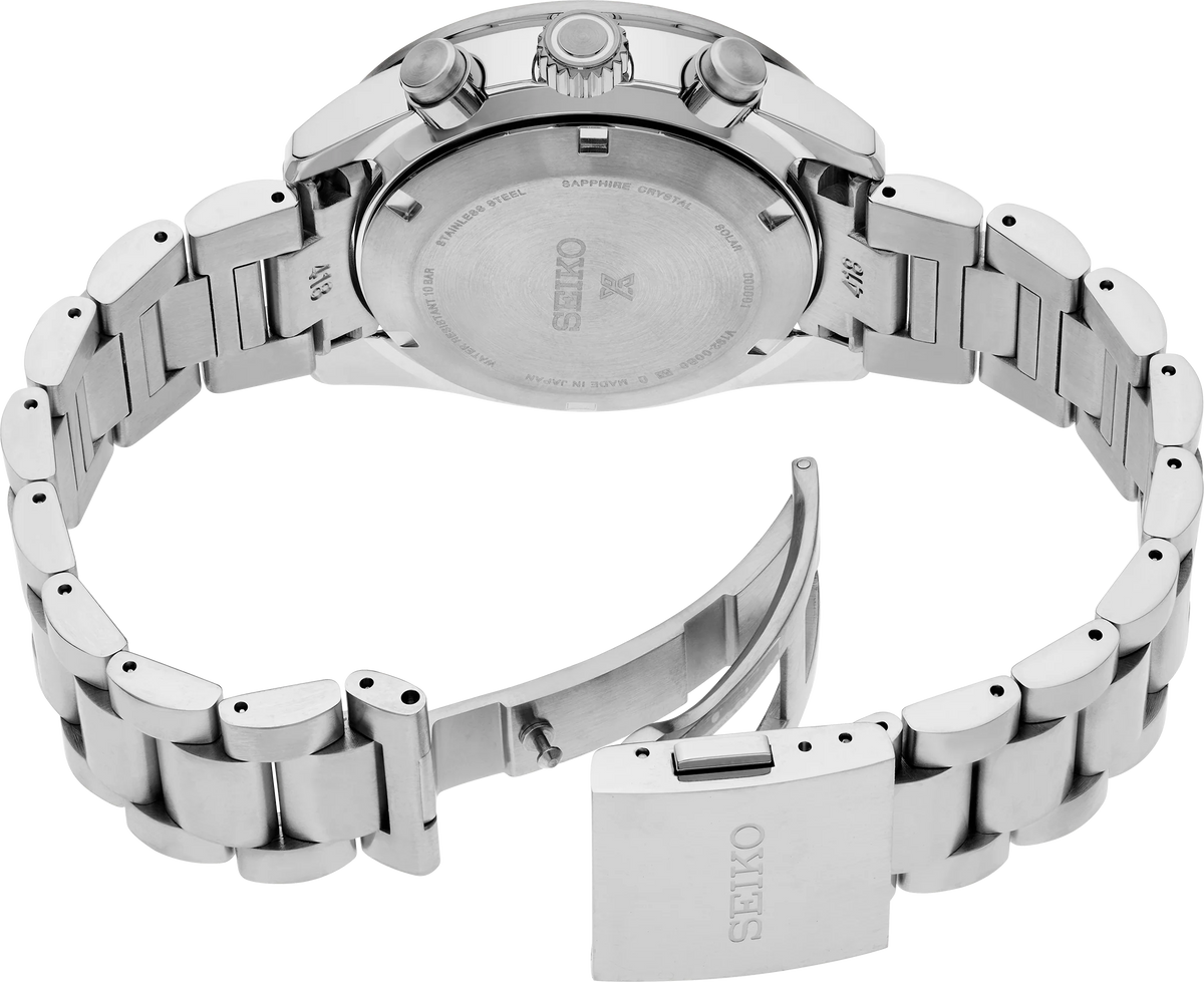 Silver stainless steel Seiko watch shown from the back, featuring a metal link bracelet, pushers on the case, and a clasp engraved with the Seiko brand name.