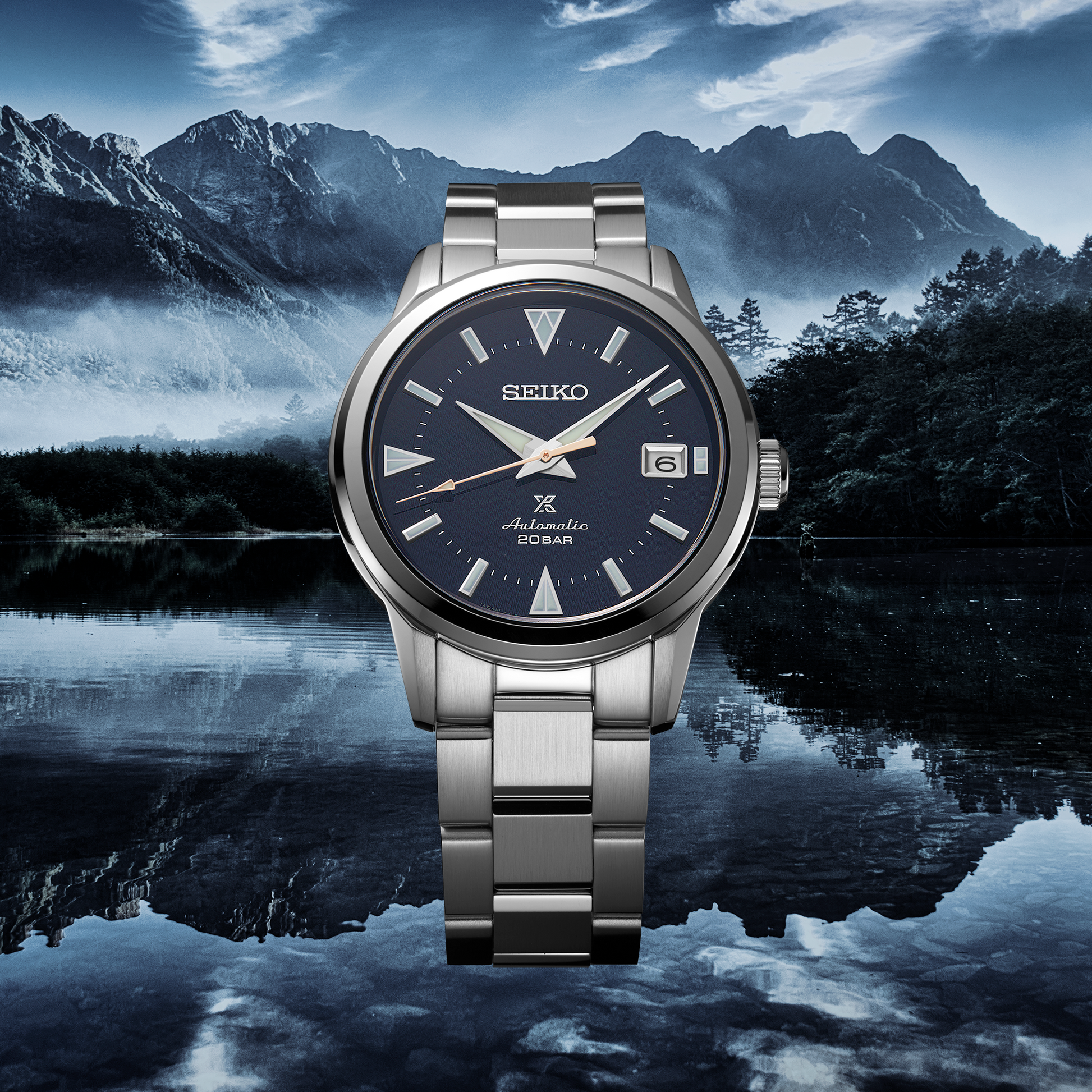 SEIKO Prospex SPB249 Alpinist – blue patterned dial with mountain-shaped markers, stainless steel case and bracelet, curved sapphire crystal, automatic movement, and 200m water resistance.