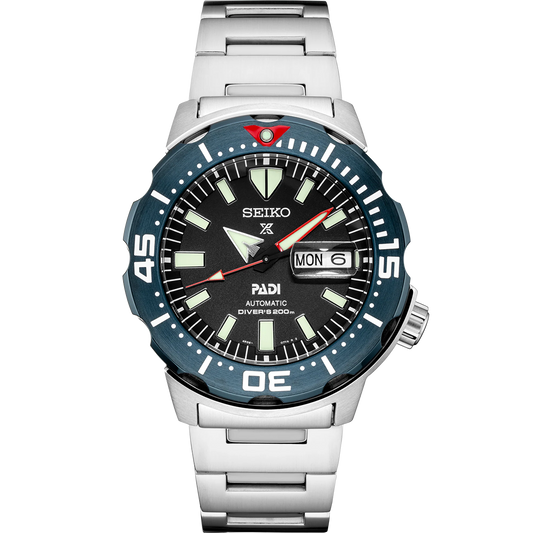 Seiko Prospex SRPE27 PADI Special Edition automatic diver watch with black dial, blue and red bezel, stainless steel case and bracelet, and magnified day-date display.
