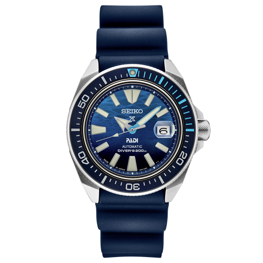 Seiko watch with blue strap and blue dial on a white background