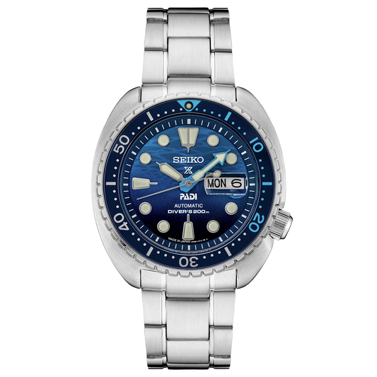 Seiko watch with blue dial and silver metal strap on a white background