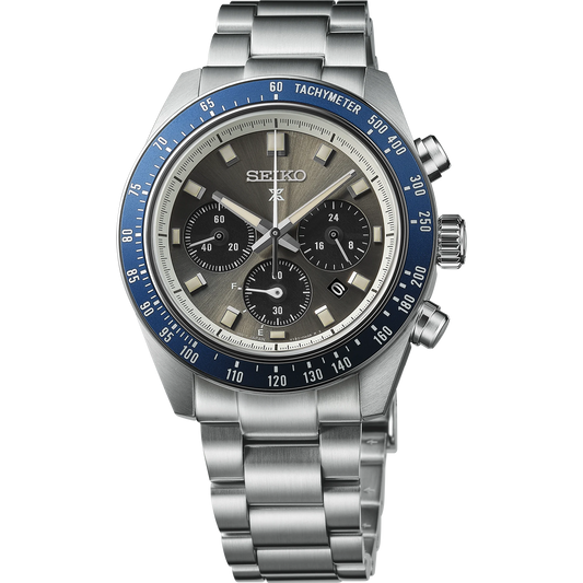 Seiko SSC939 – Prospex Speedtimer Solar Chronograph with gray sunray dial, navy blue tachymeter bezel, stainless steel case and bracelet; solar-powered with chronograph and date functions.
