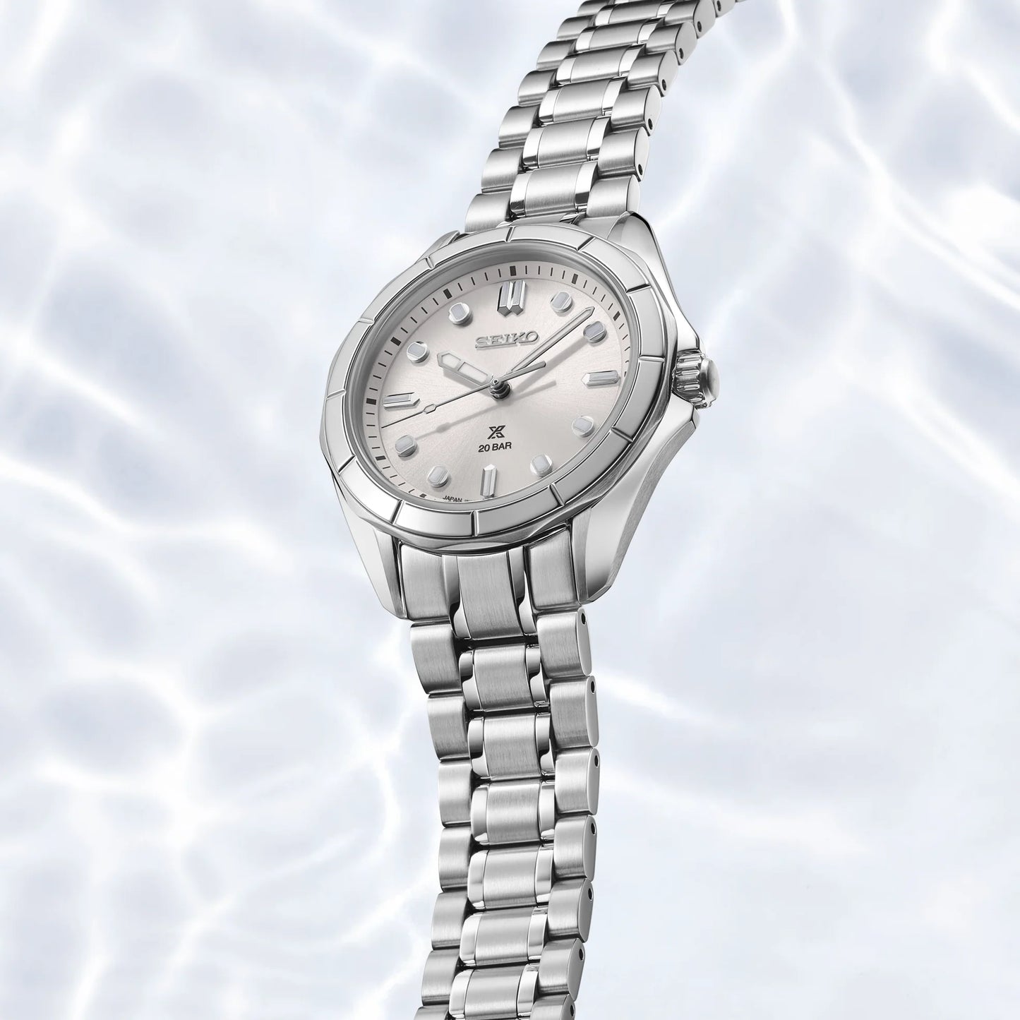 Silver Seiko watch on a light background