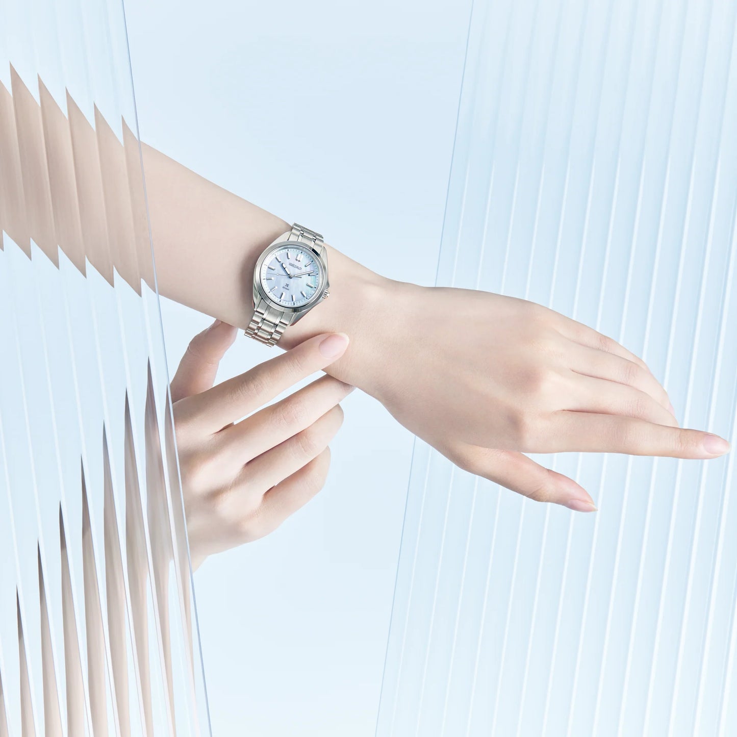 SEIKO Prospex SUR607 Sea Series – 34mm stainless steel case, light blue mother-of-pearl dial, curved sapphire crystal, quartz movement, and 200m water resistance.