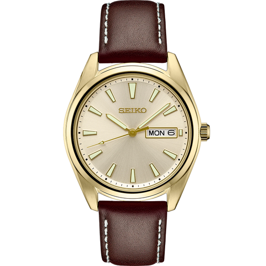 Seiko Essentials SUR450 – elegant gold-tone men’s quartz watch with champagne dial, sapphire crystal, day/date window, and brown leather strap