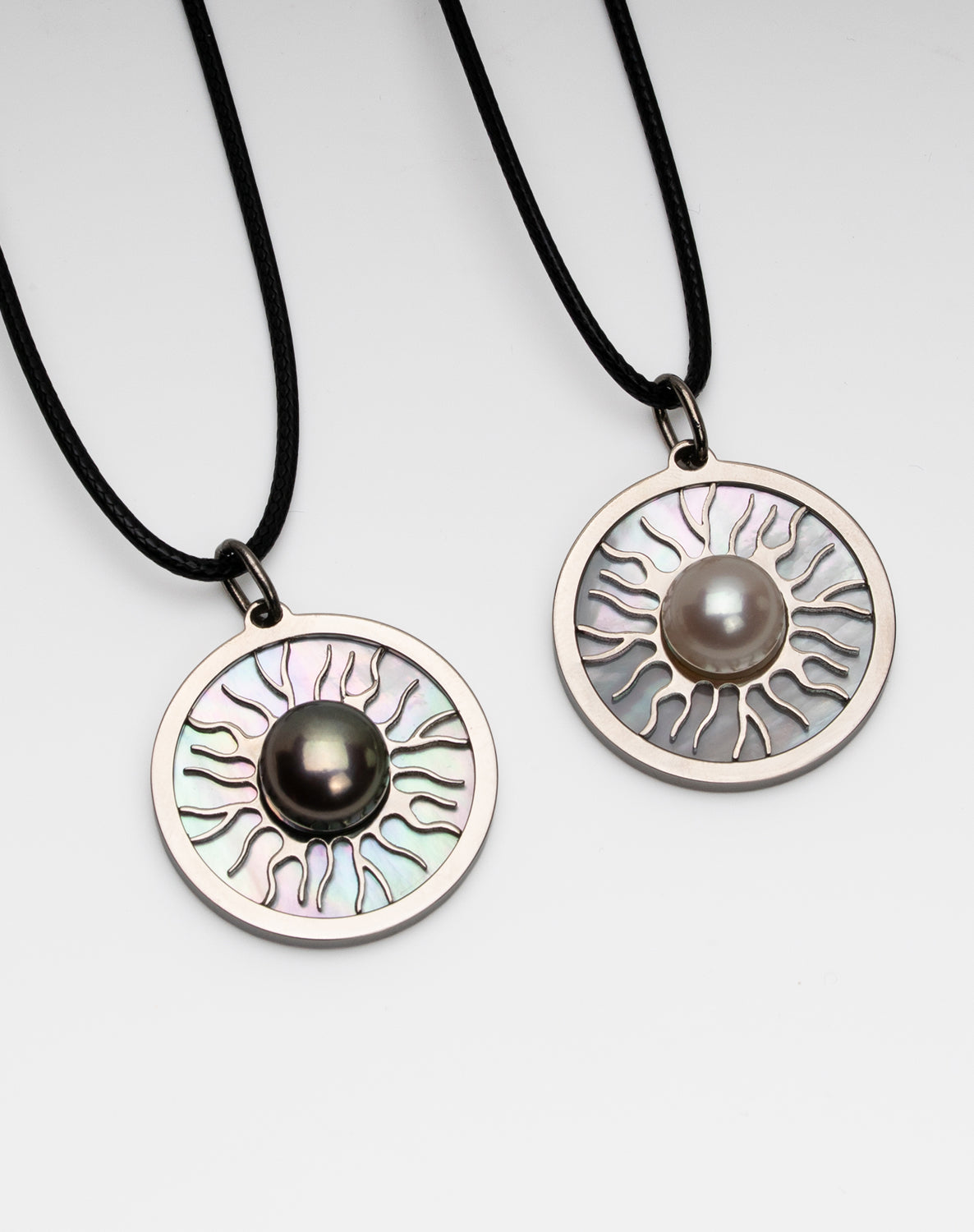 Titanium natural pink freshwater pearl necklace with mother-of-pearl inlay, 9.5mm button-shaped pearl, sun-inspired exclusive design by Miseki Jewelry, adjustable waxed cotton cord, stainless steel lobster clasp
