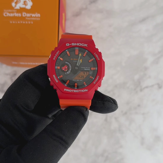 Casio G-SHOCK GA-B2100DF-4A Charles Darwin Foundation collaboration model – inspired by the Sally Lightfoot Crab with vivid red/orange colors, bio-based resin, Tough Solar, Bluetooth Smartphone Link, and Galápagos-themed design details.