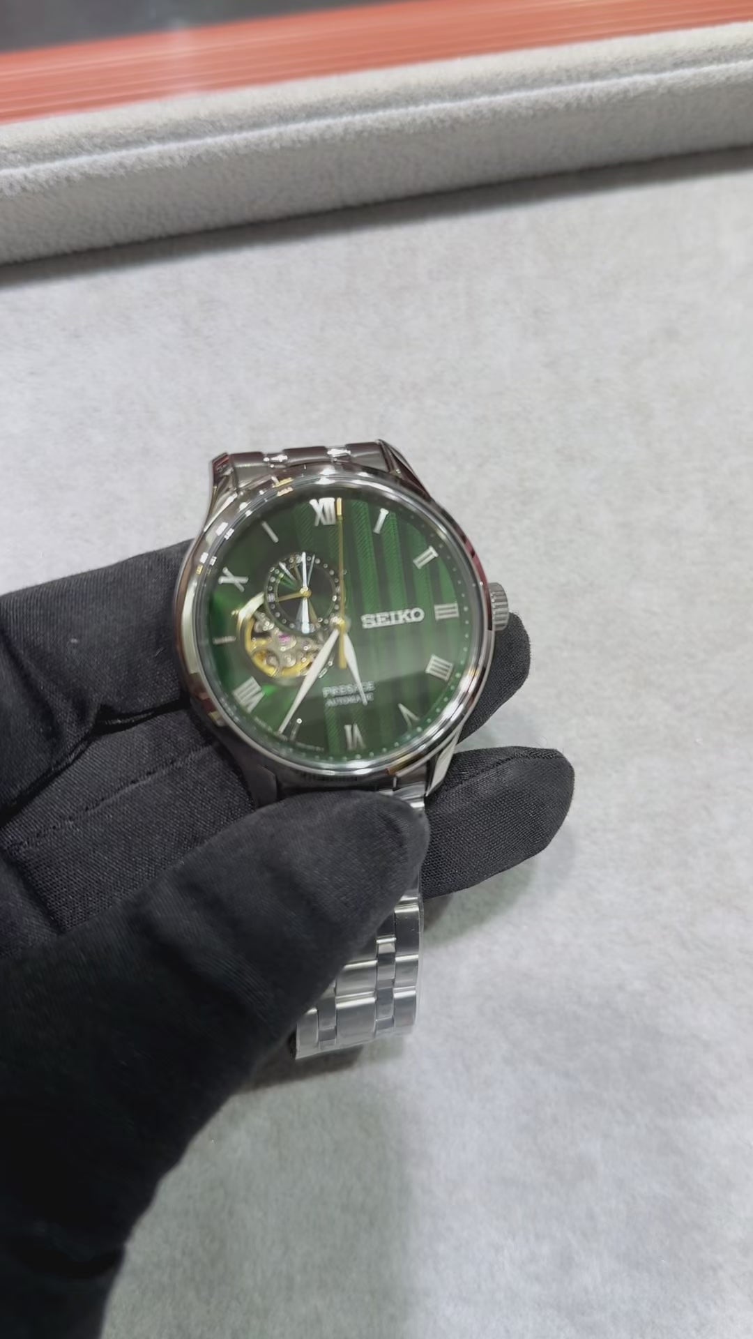 Seiko Presage SSA463 Japanese Garden automatic watch with deep green textured dial, open-heart display, Roman numeral markers, stainless steel case and bracelet, and dual-curved sapphire crystal.
