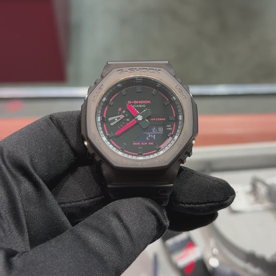 G-SHOCK GA2100K-5A analog-digital watch with brown octagonal case, Carbon Core Guard structure, nightlife-inspired dial textures, and resin band, offering shock resistance and 200m water resistance.