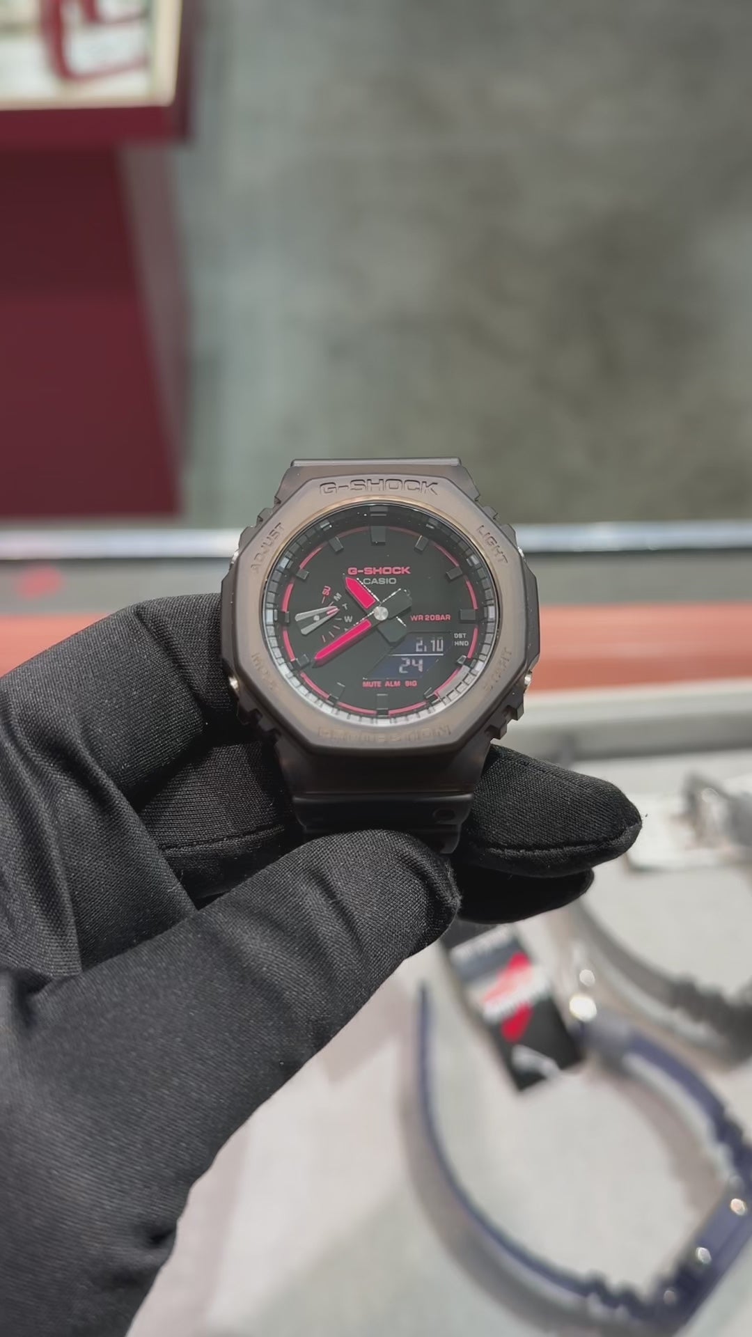 G-SHOCK GA2100K-5A analog-digital watch with brown octagonal case, Carbon Core Guard structure, nightlife-inspired dial textures, and resin band, offering shock resistance and 200m water resistance.