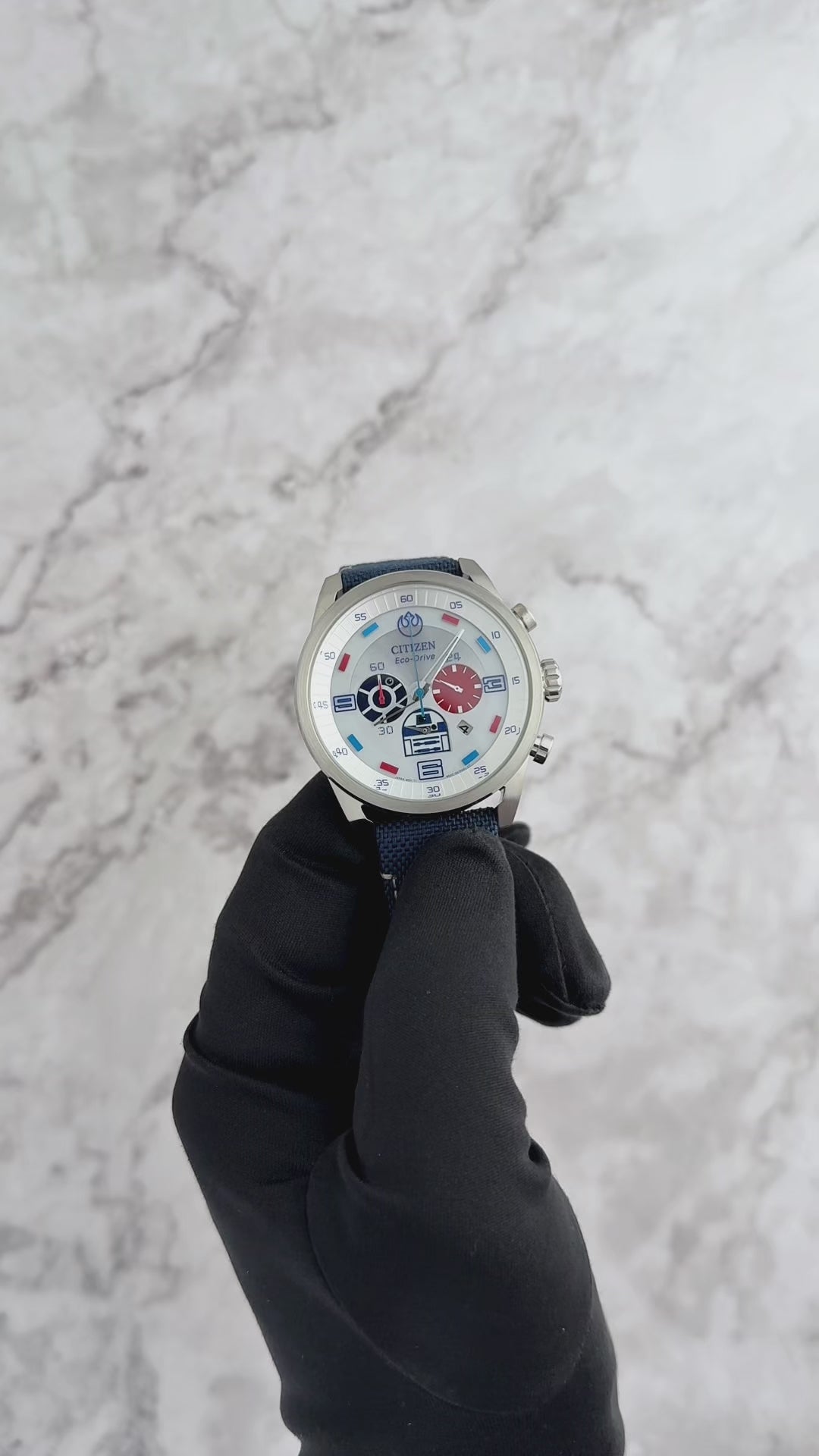 CITIZEN Star Wars R2-D2 CA4219-03W – silver-tone Eco-Drive chronograph watch with blue accents, deep blue CORDURA strap, WR100 water resistance, and R2-D2 inspired design.